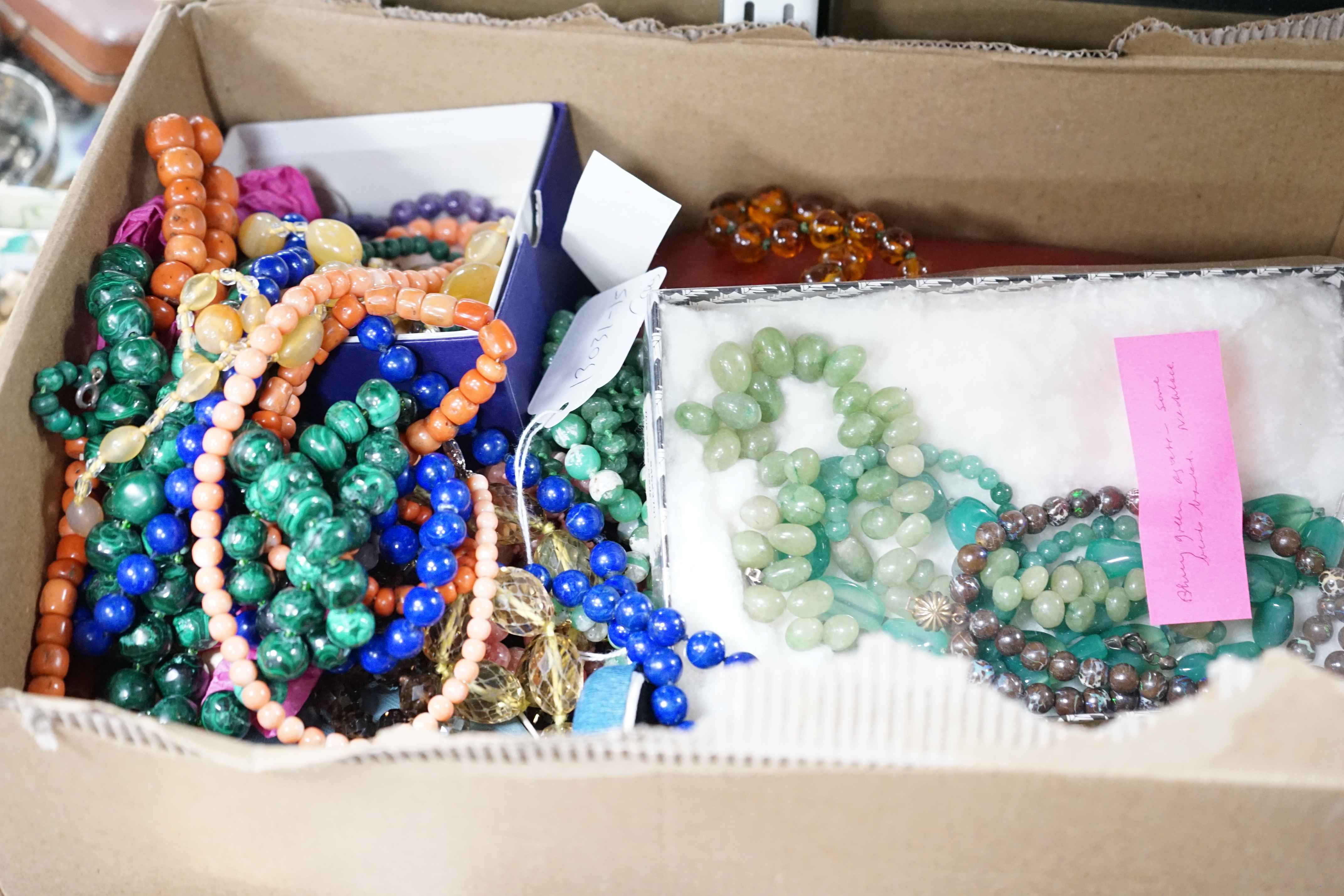 A quantity of assorted jewellery including costume, necklaces including amber, malachite, lapis lazuli and banded agate.